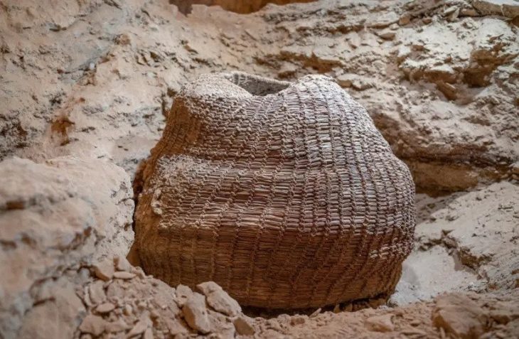 The 10,500-year-old basket as found in Muraba‘at Cave. (photo credit: YANIV BERMAN/IAA)