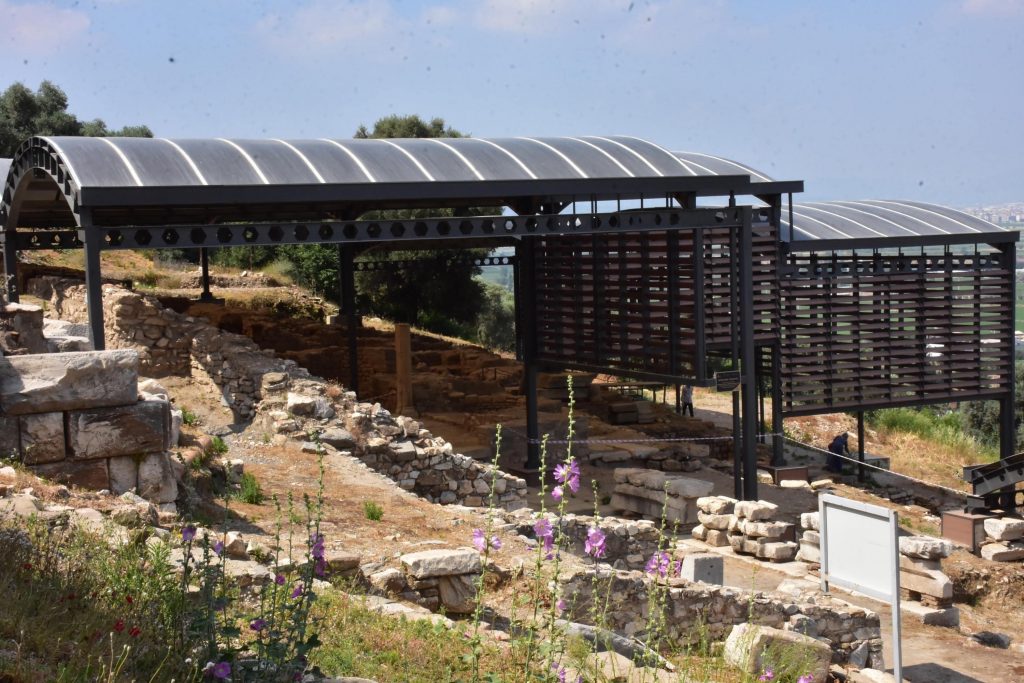 Simple roofs cover the excavation site of cisterns at the classical city of Metropolis in Izmir, Turkey,