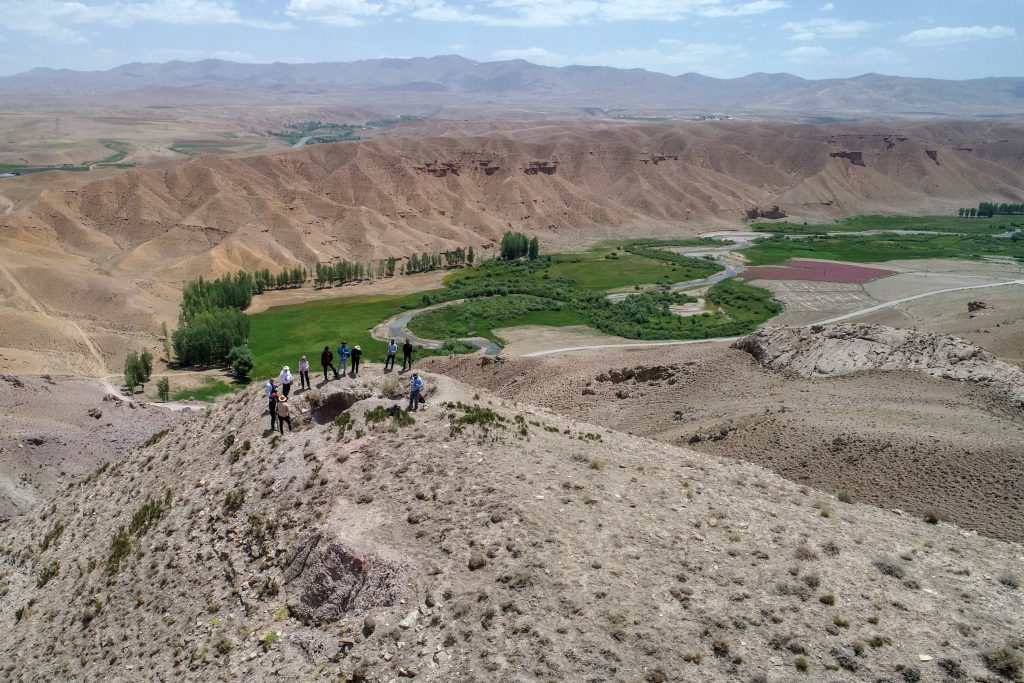 Archaeologists examine the remains of the castle on the mountain. Photo: AA