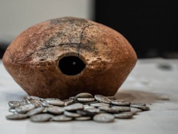 The coins were contained in an ancient jar.