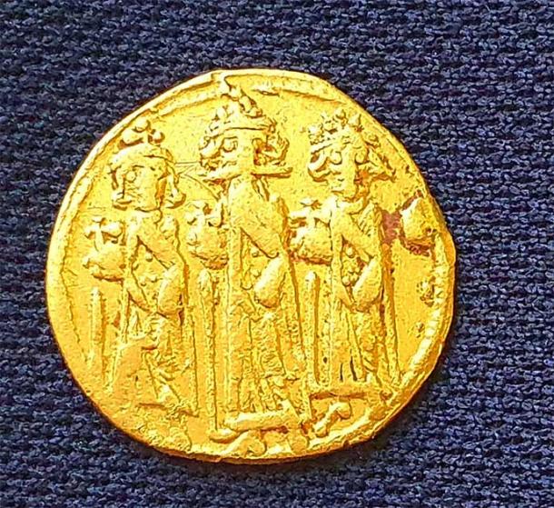 The gold coin unearthed in the excavation was minted in either 638 or 639 AD when ancient Palestine was part of the Byzantine Empire ruled by Emperor  Heraclius. (Amir Gorzalczany /  Israel Antiquities Authority )