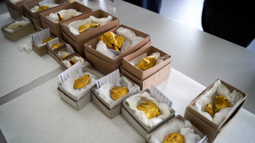 A 1,500-Year-Old Treasure Trove Full of Jewelry, Medals, and Gold Coins Unearthed by an Amateur Metal Detectorist on the Jutland Peninsula of Denmark.