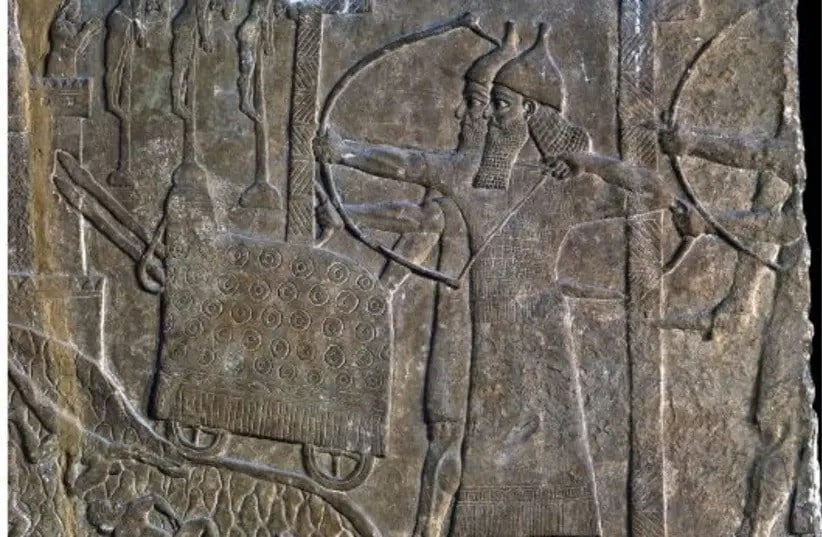 Siege scene with two massive L-shaped shields protecting Assyrian soldiers, in a relief from the palace of Tiglath-Pileser III at Nimrud (photo: Courtesy of the British Museum)
