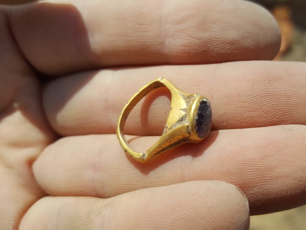 An ancient amethyst ring found during excavations near a Byzantine-era winery in Yavne, Israel, may have been worn to ward off hangovers (Eliyahu Waldman/Israel Antiquities Authority)