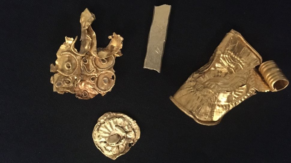 These four golden objects were also found with the hoard. (Photo: British Museum)