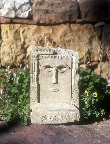 Al-'Uzza: The most famous of the three female gods, her face carved in stone