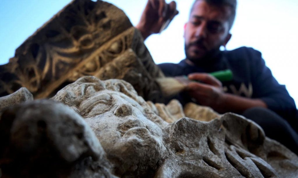 An archaeologist works on a sculpture found in Prusias ad Hypium, Düzce, northwestern Turkey.