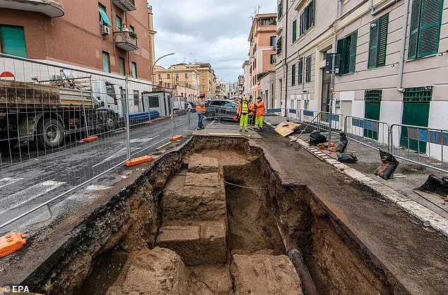 Archaeologists were called in after workers laying pipes for utility firm Acea on the Via Luigi Tosti (pictured) in the city's Appio Latino quarter came across the buried tombs.