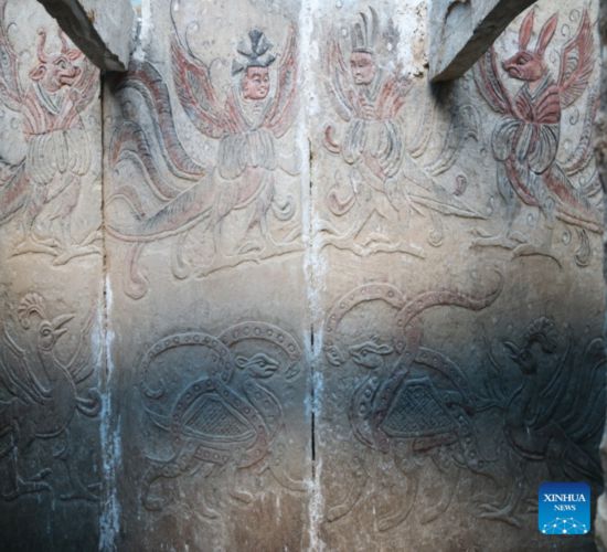  This undated photo provided by the Shanxi Provincial Institute of Archaeology shows carved images on the outer coffin in the unearthed tomb in Datong City, north China's Shanxi Province. (Shanxi Provincial Institute of Archaeology/Handout via Xinhua)