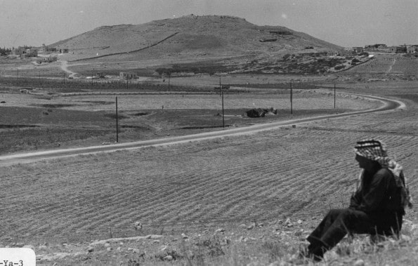 Siegfried Horn sitting near Tell Hesban, Jordan