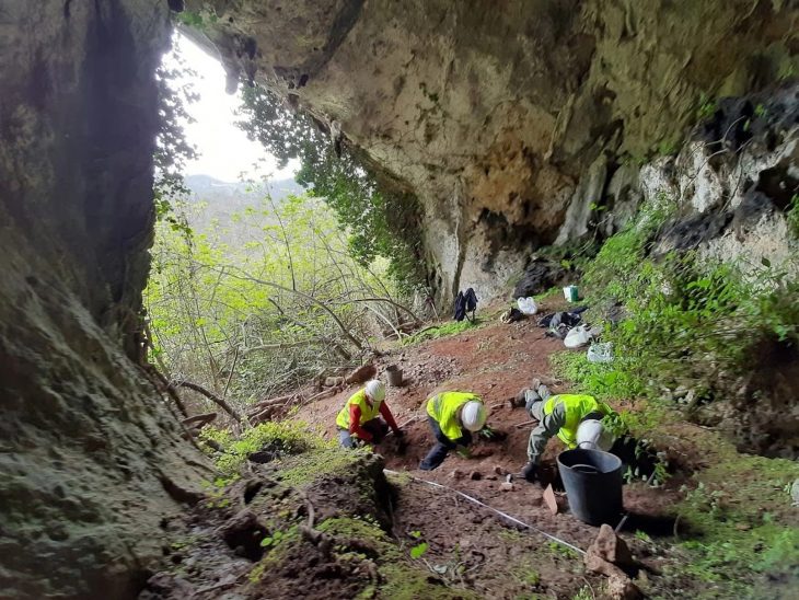 Three archaeologists work at the site of the Asturian-Roman treasure of La Cuesta de Berció (Asturias).