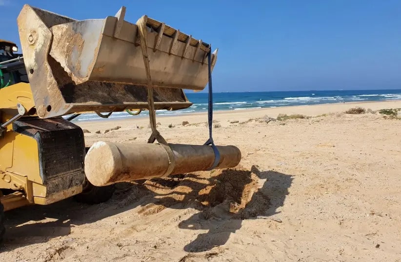 Byzantine marble pillar after being removed from the ground in the Ashdod sand dunes.. (credit: Israel Antiquities Authority)