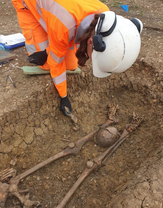 Several of the bodies had the skull removed from the body and placed between the deceased’s legs (Picture: PA)