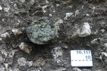 The ceramic pot with the coins after professional excavation by employees of Archeology Baselland in Switzerland. (Archaologie Baselland)