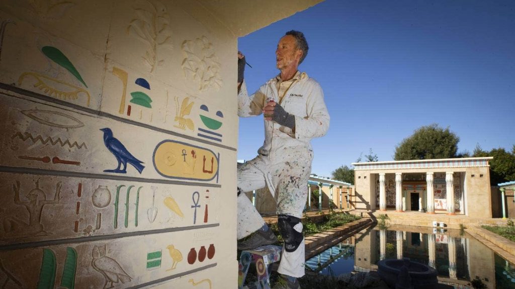 Artist Jeremy Shirley adds the final touches to the Ancient Egyptian Garden ahead of its official opening.