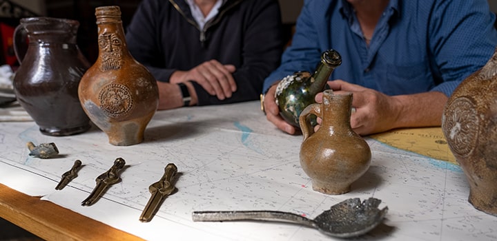 Julian and Lincoln Barnwell examine some of their discoveries. © UEA