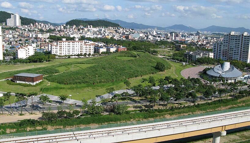 General perspective of Daeseong Dong Tumulti in Gimhae. This funerary complex dates to the Three Kingdoms period of Korea and more than 200 graves have been documented. Photo: John Bahk