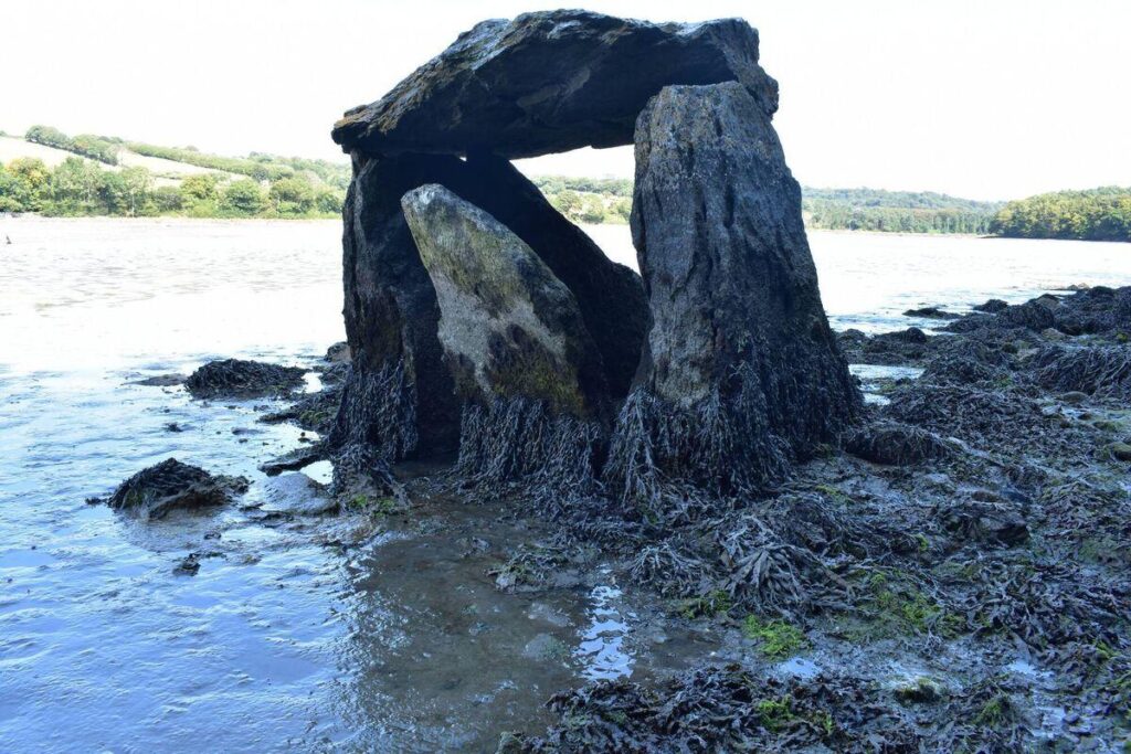 The Carraig á Mhaistin megalithic structure at Rostellan, on the eastern shore of Cork Harbour, Ireland. The monument is now partly submerged by the tides, while much of its associated cairn may remain buried beneath estuarine mud. Credit: Michael Gibbons