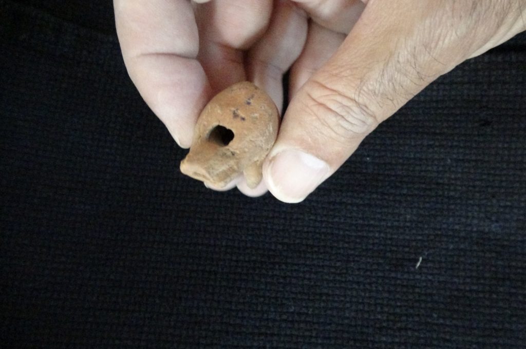 A 2,000-year-old whistle made of terracotta from the Roman period was found in a child's grave as a grave gift, in Çanakkale, Turkey. Photo: İHA
