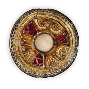 A garnet set gilt silver disc brooch