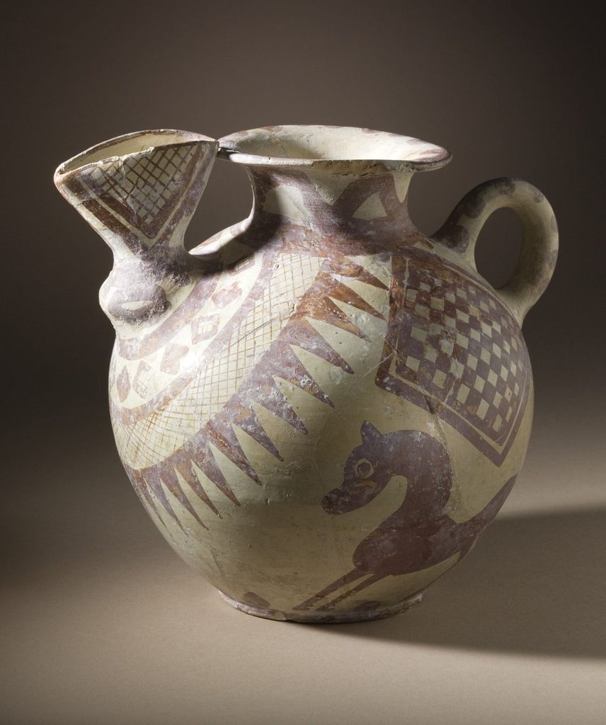 Bridge-spouted jar from Tepe Sialk, circa 800-600 B.C.; buff ware, creamslip, reddish-orange painted decoration. Height: 20 cm. Los Angeles County Museum of Art