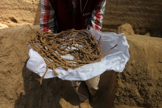 Ceramic objects and rope were found near the burial bundle. Photo: Reuters