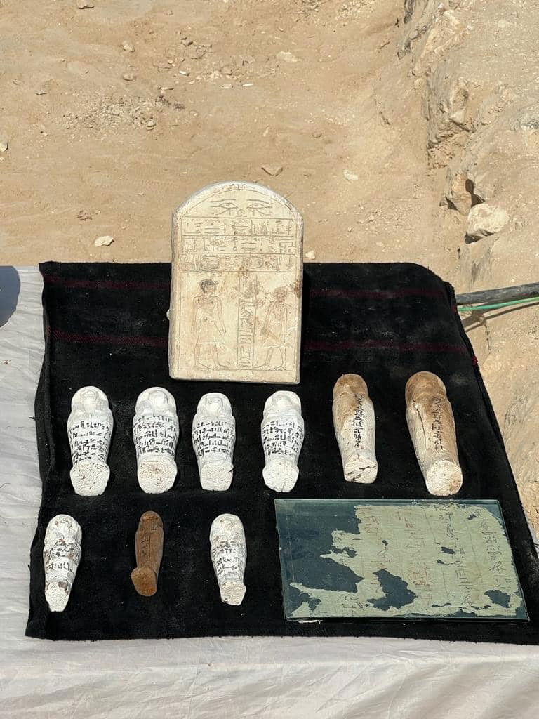 Stele, ushabtis and fragment of papyrus found in Dra Abu El Naga  Photo: MoTA Egypt.