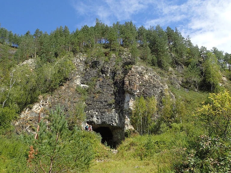 The entrance to Denisova cave, where the pendant was discovered. Photo: Richard G. Roberts