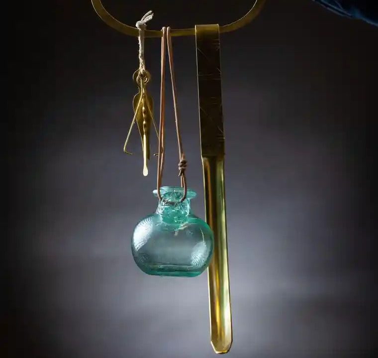 A reconstruction of a Roman cleaning set, including a strigil (skin scraper), oil bottle, nail cleaner and tweezers. Photograph: Richard Lea-Hair/English Heritage