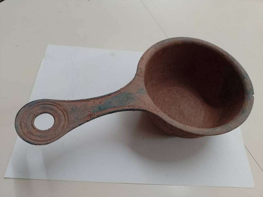 The handle of an ancient Roman saucepan. Photo from National Museum Wales