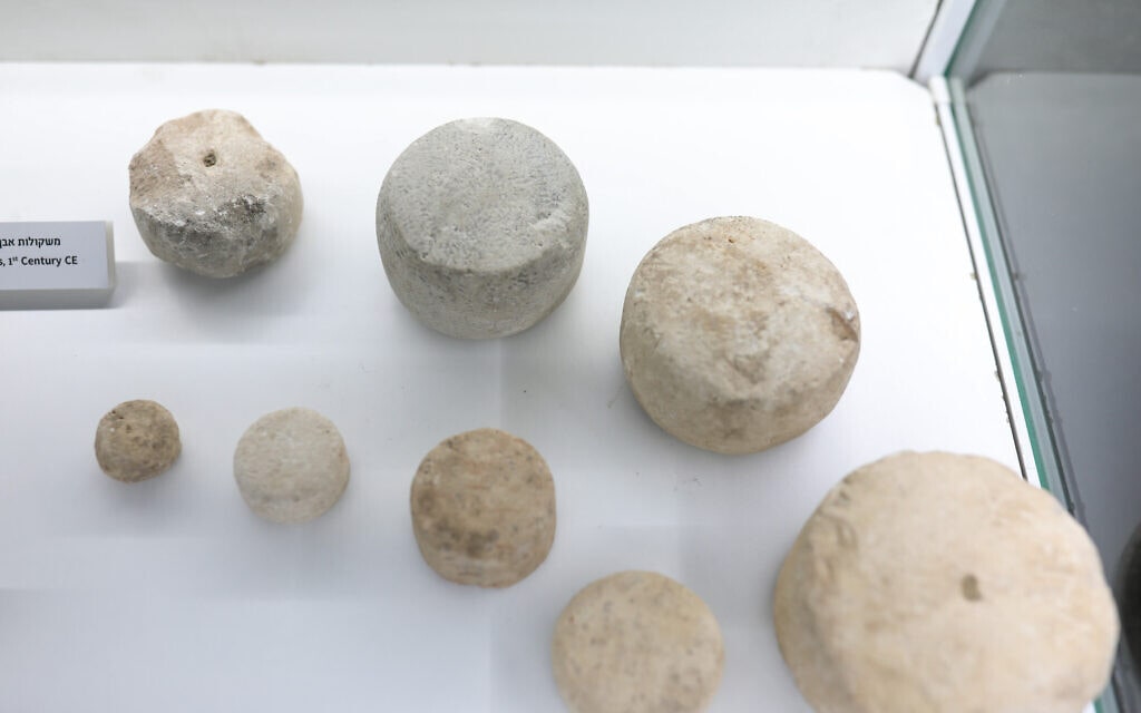 Stone weights discovered on the Pilgrimage Path. The inscription joins these findings attesting to the commercial nature of the area. Photo: Tomer Avital