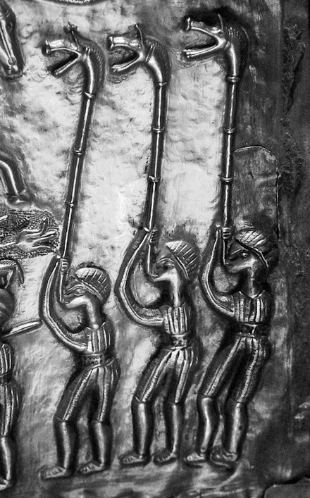 Three carnyx players depicted on plate E of the Gundestrup cauldron. Photo: Wikipedia
