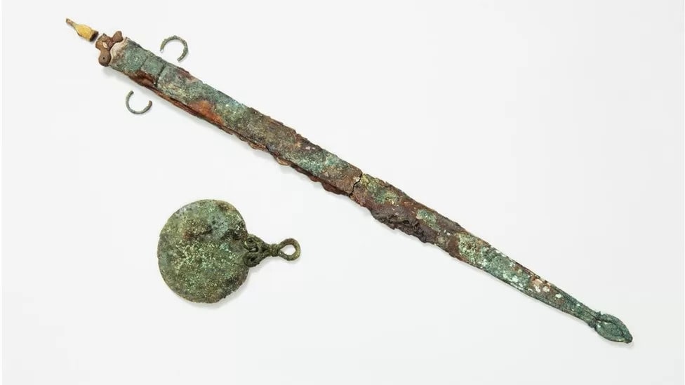 The remains were discovered alongside a 2000-year-old sword and mirror. Photo: Historic England