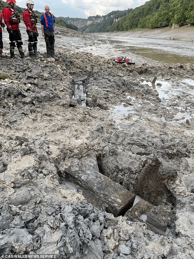 Archaeologists had just a two-hour window to dig it out and had to be assisted by specialist rescue teams because of the perilous nature of their task. Photo: CAS Wales News Service