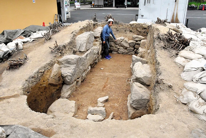 The ancient stone burial chamber discovered at a parking lot in Ikaruga, Nara Prefecture. Photo: Kunihiko Imai