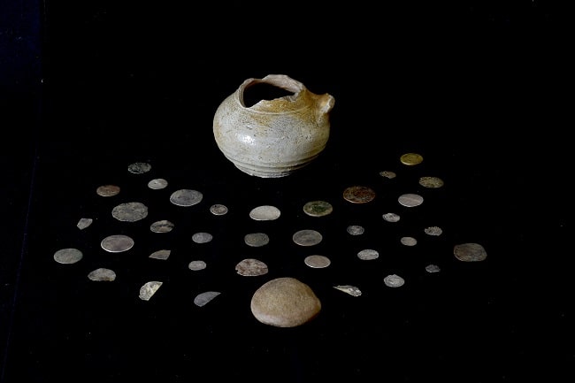 The coin hoard, pot and lid. Credit Gareth Beale