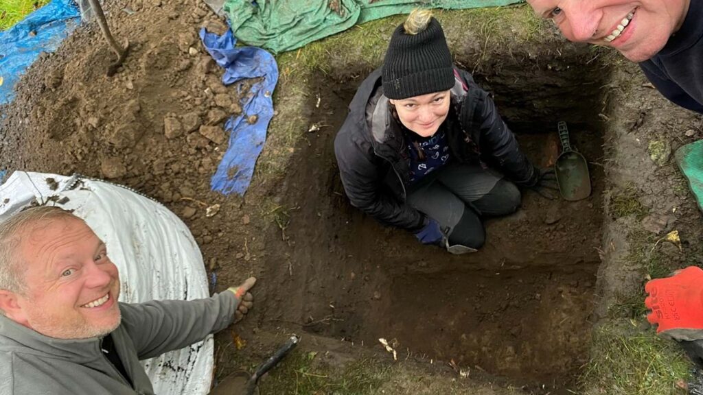 The picture shows Dr. Murray Cook (bottom left) and other members of the dig with the remains of the ancient Roman Road. Photo: Stirling Council