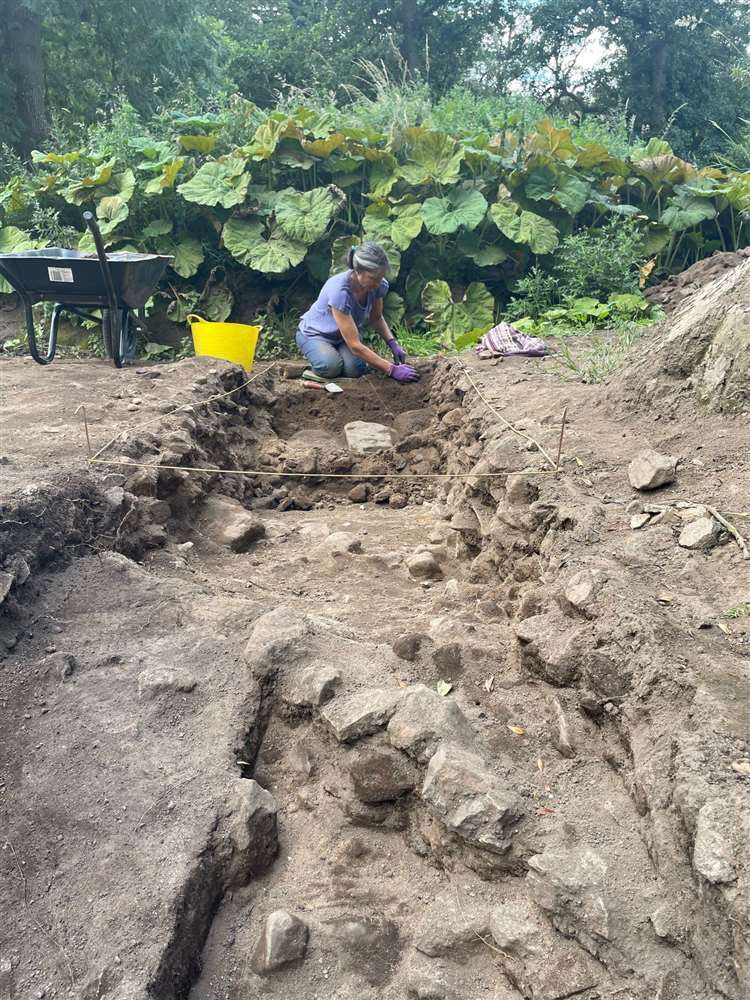 Uncovering a path at the site.