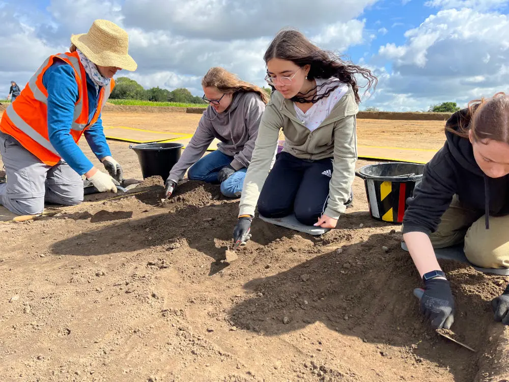 Volunteers excavating the remains of the ditch that enclosed the royal compound, under the guidance of Faye Minter Photo: Archaeological Archives and Projects Manager, Suffolk County Council