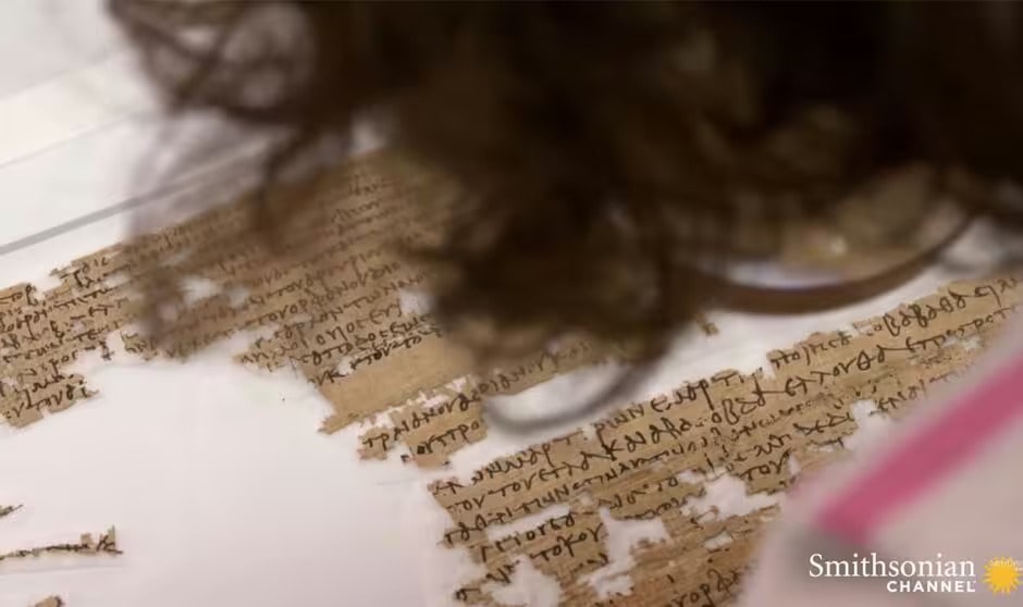 Professor Hannah Cotton-Paltiel examines the scrolls, which tell of a powerful businesswoman. Image: Youtube/Smithsonian Channel