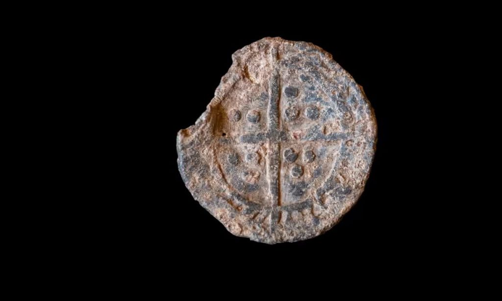 One side of the ‘boy bishop’ token found at the Oxburgh estate in Norfolk depicts a long cross. Photo: James Dobson/National Trust Images