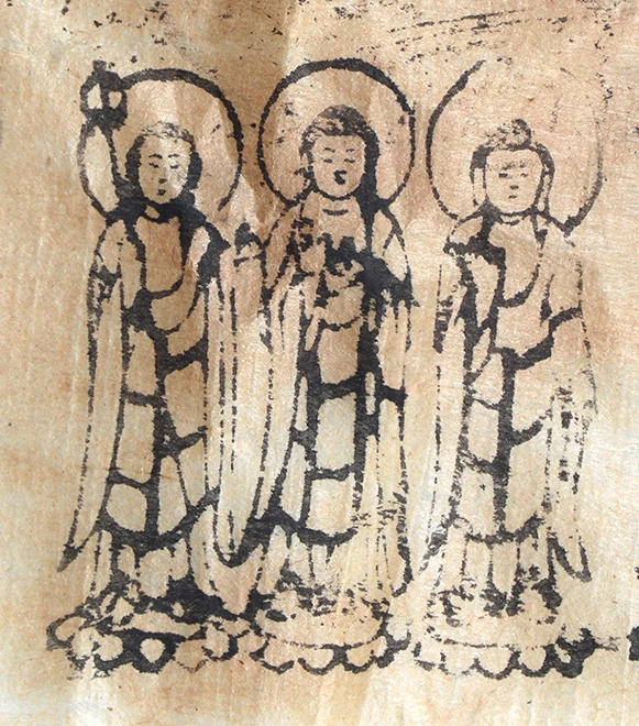 An ink image recovered from the hollowed out head of a religious statue shows Buddha, right, Bhaisajyaguru, center, and Ksitigarbha standing beside each other. They are all from the same single stamp. Photo: Fukuyama City