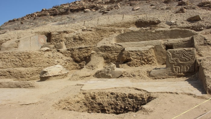 A carving of a human with a bird’s head and a painting were found at the ancient temple. Photo:  Peru Ministry of Culture