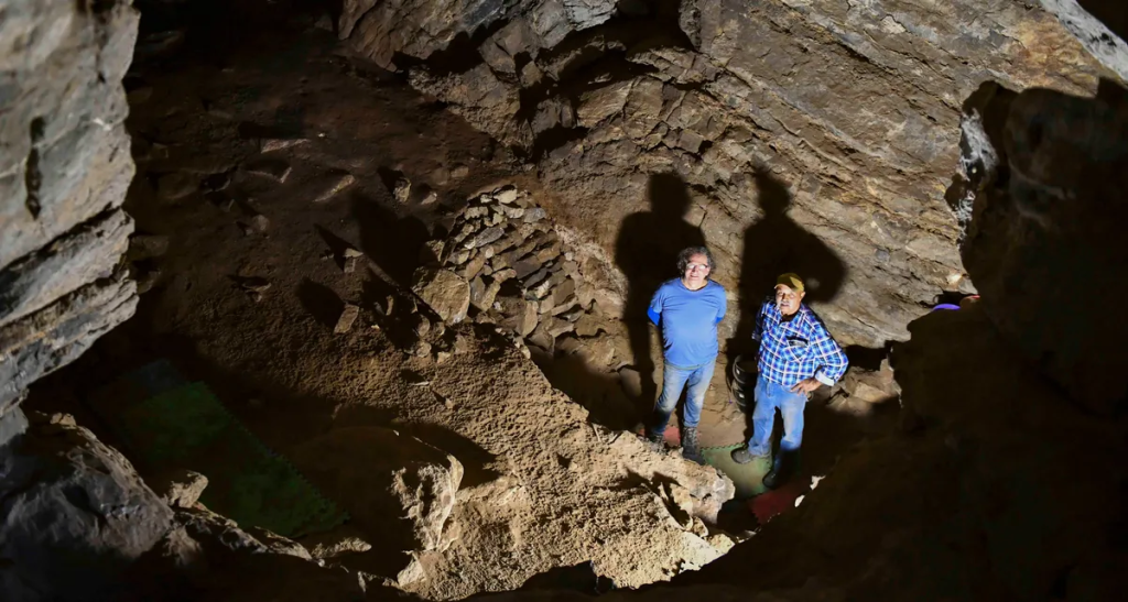 GunaiKurnai Elder Uncle Russell Mullett and Monash University's Professor Bruno David in Cloggs cave where evidence of the oldest continuously practiced ritual in the world has been found. Photo: Monash University