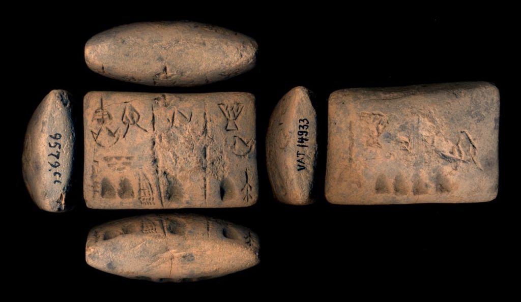 Cylindrical seals were small stone objects with intricate carvings, rolled over clay tablets to leave an impression. Photograph of a tablet with signs in proto-cuneiform. Photo Credit: CDLI – Cuneiform Digital Library Initiative