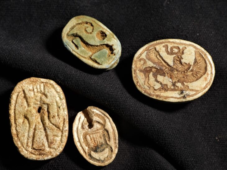 Egyptian-style scarabs with additional cultural influences found at the site, evidence of encounters between different peoples. Credit: Israel Antiquities Authority