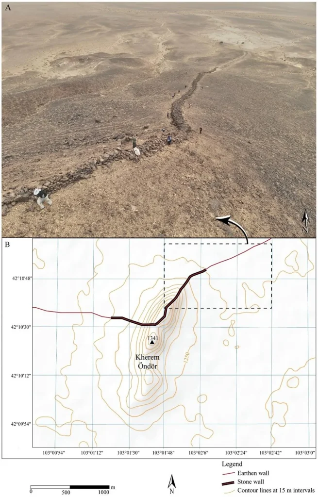 Black Stone Wall Section. (A) Aerial drone image showing the preserved segment of the stone wall running along the hillside. (B) Topographic map highlighting the wall’s strategic route across Kherem Öndör Peak, with earthen sections marked in red and stone segments in black. Credit: D. Golan et al., Land (2025).