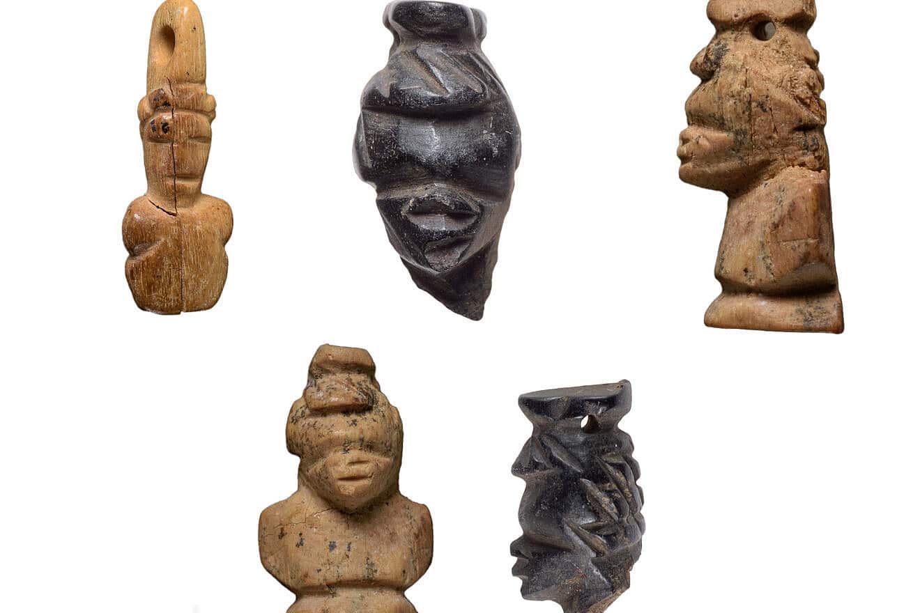 Heads of carved African figures discovered at Tel Malhata. Credit: Dafna Gazit, Israel Antiquities Authority