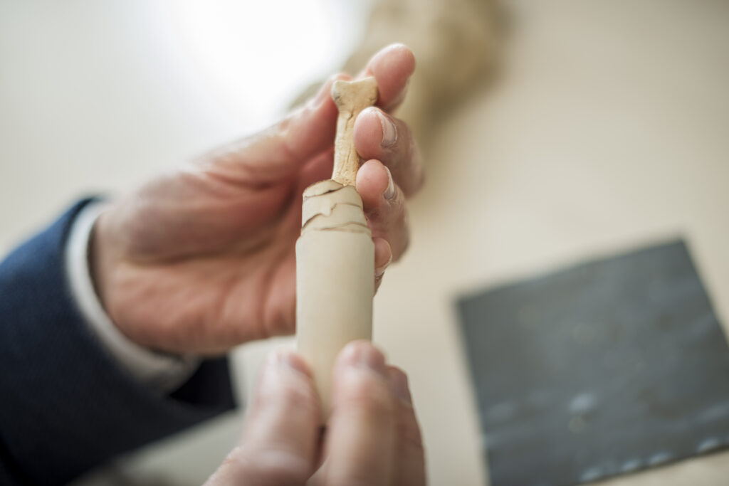 Those who wanted to strengthen their curse would wrap the tablet around a bone. Credit: Damian Gorczany