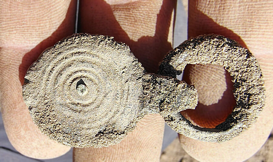 This fitting with an eyelet, from the old cultural layer, is from a Roman military belt dating to the 4th or 5th century. Credit: EggensteinExca / S. Knippschild